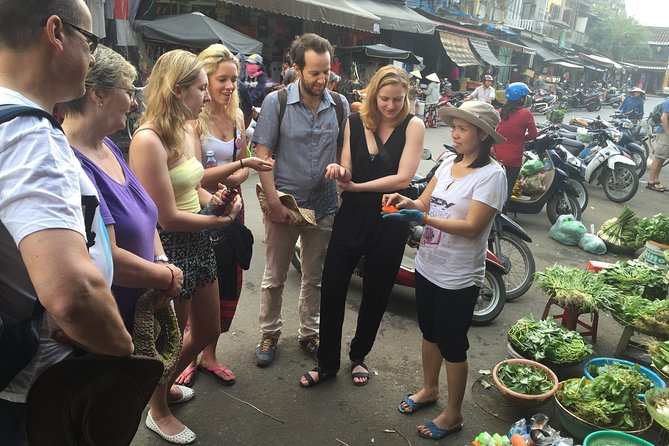Traditional Cooking Class with Basket Boat Ride and market Tour - Four dishes, one busy kitchen