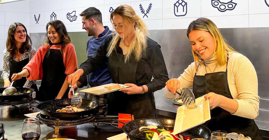 Valencia: Paella Cooking Class with Central Market Tour - Cooking Paella With a Professional Chef