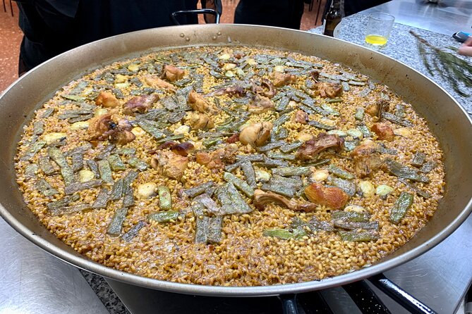 Valencian paella cooking class, tapas and visit to Ruzafa market. - Meeting at San Valero and entering Ruzafa Market