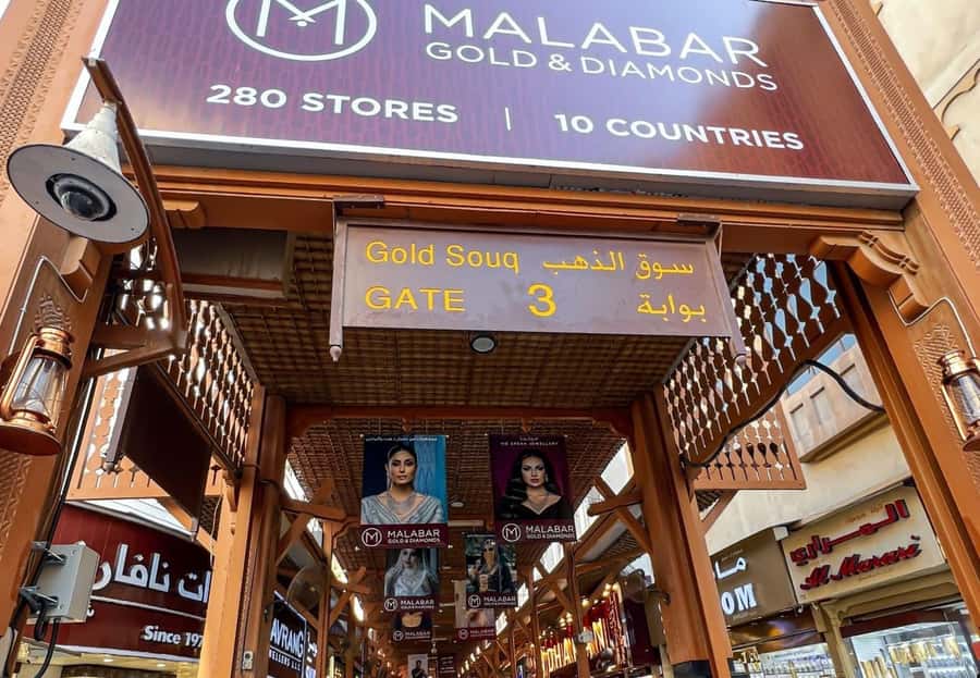 walking tour in old dubai, souks, abra boat, old town - Textile Market and Al Souq Al Kabeer