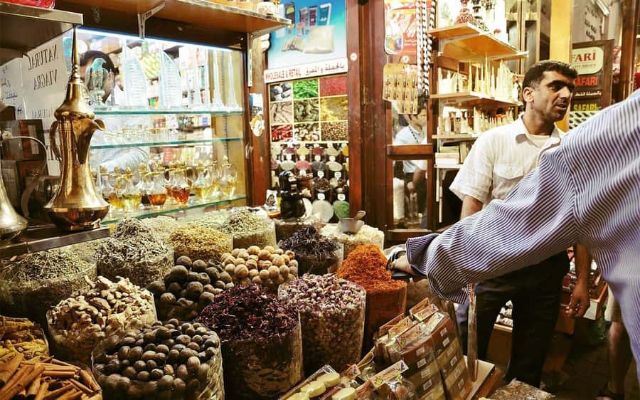walking tour in old dubai, souks, abra boat, old town - Crossing Dubai Creek by abra